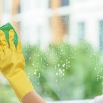 Image of Female Hand Washing Window/Cleaning